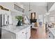 Open-concept kitchen with stainless steel appliances and a large island perfect for entertaining at 8150 Albritton Downs, Cumming, GA 30041