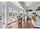 Spacious kitchen and seating area with natural lighting and access to deck at 8150 Albritton Downs, Cumming, GA 30041