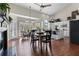 Eat-in kitchen offers modern appliances, a breakfast bar, and easy access to the outdoor area at 8150 Albritton Downs, Cumming, GA 30041