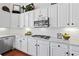 Bright kitchen features white cabinets, granite countertops, and stainless steel appliances at 8150 Albritton Downs, Cumming, GA 30041