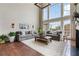 This living room features high ceilings, a cozy fireplace, and ample seating for entertaining at 8150 Albritton Downs, Cumming, GA 30041