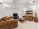 Spacious living room featuring neutral colors, plush seating, and cozy lighting at 8150 Albritton Downs, Cumming, GA 30041