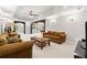 Spacious living room with cozy seating, open floor plan, and recessed lighting at 8150 Albritton Downs, Cumming, GA 30041