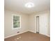 A cozy bedroom with neutral carpet and a bright window creates a warm atmosphere at 6251 Pisgah Sw Rd, Mableton, GA 30126