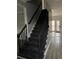 Dark-stained staircase with simple railing leading to the upper level at 7592 Watson Kaye, Stone Mountain, GA 30087