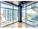 Spacious living room with hardwood floors and expansive windows with city views at 250 Pharr Ne Rd # 1507, Atlanta, GA 30305