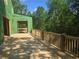 New wooden deck overlooking wooded area on a house still under construction at 170 Cedarwood Ln, Roswell, GA 30075