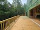 New wooden deck overlooking wooded area on a house still under construction at 170 Cedarwood Ln, Roswell, GA 30075