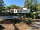 Backyard featuring a trampoline, bench, and natural surroundings in a serene setting at 3380 Lake Valley Nw Rd, Atlanta, GA 30331