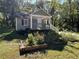 Charming home featuring a cozy front porch and lovely garden boxes in the yard at 3380 Lake Valley Nw Rd, Atlanta, GA 30331