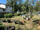 Lush backyard garden with planted pots, greenery, and a partial view of the house at 3380 Lake Valley Nw Rd, Atlanta, GA 30331