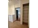 Hallway featuring a closet and a view into the living room at 3380 Lake Valley Nw Rd, Atlanta, GA 30331