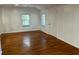 Bright living room with hardwood floors, natural light and fresh white walls at 3380 Lake Valley Nw Rd, Atlanta, GA 30331