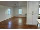 Spacious living room featuring gleaming hardwood floors and bright white cabinets at 3380 Lake Valley Nw Rd, Atlanta, GA 30331