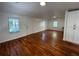 Bright living room featuring hardwood floors, natural light from multiple windows and white cabinets at 3380 Lake Valley Nw Rd, Atlanta, GA 30331