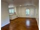 Bright living room boasts hardwood floors and an open floor plan to the kitchen area at 3380 Lake Valley Nw Rd, Atlanta, GA 30331