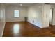 Bright living room featuring hardwood floors and white cabinets for ample storage at 3380 Lake Valley Nw Rd, Atlanta, GA 30331