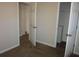 A bright bedroom featuring neutral paint and carpet, with a walk-in closet at 434 Spring Leaf Dr, Dallas, GA 30157