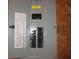 Electrical breaker box with neatly arranged circuit breakers and safety labels at 434 Spring Leaf Dr, Dallas, GA 30157