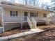 Inviting single-story home featuring a charming porch, well-maintained yard and sidewalk at 434 Spring Leaf Dr, Dallas, GA 30157