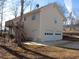 Two-car garage with a private entrance and staircase leading to an upper deck or living space at 434 Spring Leaf Dr, Dallas, GA 30157