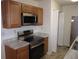 Well-equipped kitchen with modern appliances and wood cabinets at 434 Spring Leaf Dr, Dallas, GA 30157