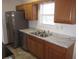 This bright kitchen offers stainless steel appliances and a double sink at 434 Spring Leaf Dr, Dallas, GA 30157