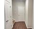 Hallway with wood floor and storage at 4326 Water Elm Aly, Doraville, GA 30360