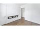 Simple bedroom with hardwood floors and built-in shelving at 377 Anders N, Chattahoochee Hills, GA 30268