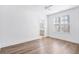 Bright bedroom with hardwood floors and access to bathroom at 377 Anders N, Chattahoochee Hills, GA 30268