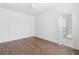 Light-filled bedroom with hardwood floors and an ensuite bathroom at 377 Anders N, Chattahoochee Hills, GA 30268