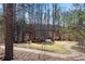 Stone gazebo with seating area in wooded setting at 377 Anders N, Chattahoochee Hills, GA 30268