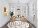 Bright dining room with hardwood floors and staged furniture at 377 Anders N, Chattahoochee Hills, GA 30268