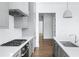 Modern kitchen with gray cabinets and hardwood floors at 377 Anders N, Chattahoochee Hills, GA 30268