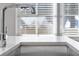 Sleek, chrome faucet and large kitchen sink at 377 Anders N, Chattahoochee Hills, GA 30268