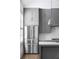 Modern kitchen with stainless steel appliances and gray cabinets at 377 Anders N, Chattahoochee Hills, GA 30268