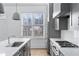 Modern kitchen with island and stainless steel appliances at 377 Anders N, Chattahoochee Hills, GA 30268
