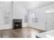 Open living area with hardwood floors and fireplace at 377 Anders N, Chattahoochee Hills, GA 30268