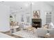 Bright living room with fireplace and hardwood floors at 377 Anders N, Chattahoochee Hills, GA 30268