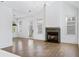Spacious living room featuring hardwood floors and fireplace at 377 Anders N, Chattahoochee Hills, GA 30268