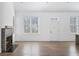 Living room with hardwood floors and fireplace at 377 Anders N, Chattahoochee Hills, GA 30268