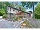 Brick home with carport, landscaping, and walkway leading to the entrance at 2953 Collier Nw Dr, Atlanta, GA 30318