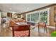 Comfortable living room featuring large window, sleek ottomans, and stylish decor at 2953 Collier Nw Dr, Atlanta, GA 30318
