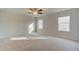 Sunlit Primary bedroom with carpet and large windows at 125 Belvedere Rd, Mcdonough, GA 30253