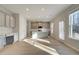 Bright kitchen featuring an island, gray cabinets, and hardwood floors at 125 Belvedere Rd, Mcdonough, GA 30253