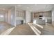 Open kitchen and dining area features gray cabinets, island with sink, and lots of natural light at 125 Belvedere Rd, Mcdonough, GA 30253