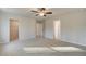 Carpeted main bedroom with entrances to a walk-in closet and ensuite bath at 125 Belvedere Rd, Mcdonough, GA 30253