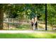 Couple strolling along a tree-lined path at 4671 Collins Ave, Acworth, GA 30101