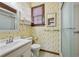 Patterned bathroom featuring a glass enclosed shower, and white fixtures at 1366 Emory Ne Rd, Atlanta, GA 30306