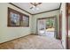 Sunlit bedroom with sliding doors to a backyard, carpeted floor, and windows at 1366 Emory Ne Rd, Atlanta, GA 30306